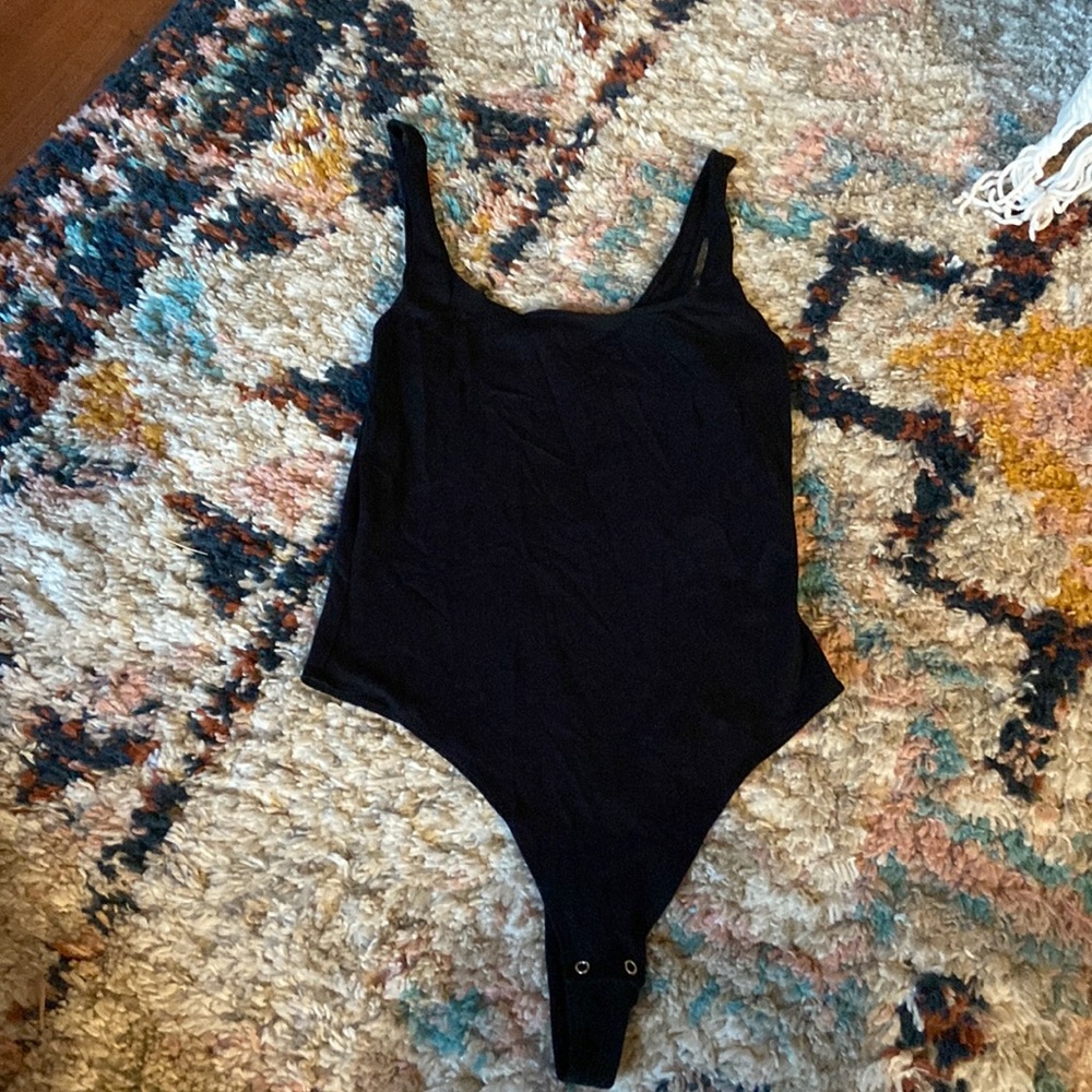 Gently used black garage body suit